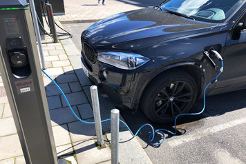 The photo shows a car being charged