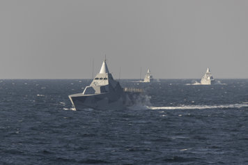 Two corvettes (small warships) out at sea.