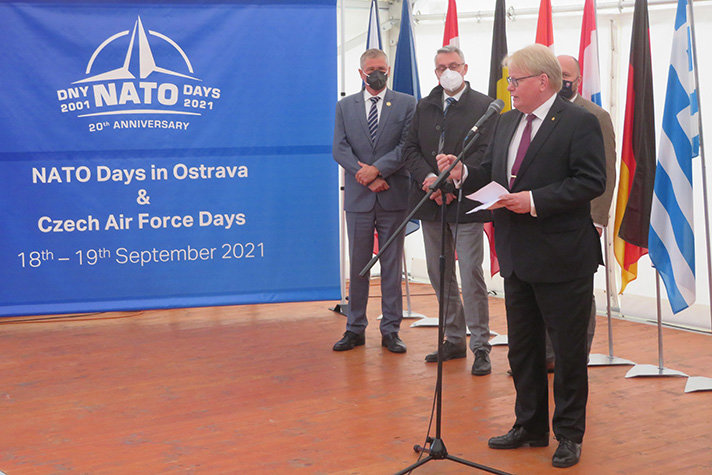 Peter Hultqvist standing on stage , giving a speech.