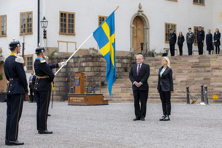 Peter Hultqvist and Klaudia Tanner standing outdoors at Karlberg Palace, Stockholm. 