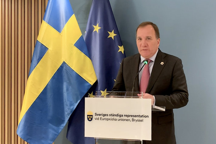Swedish Prime Minister Stefan Löfven is speaking to journalists at a press conference.
