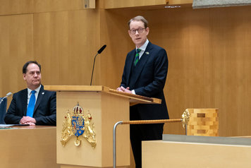 Billström in the speaking chair of the Riksdag